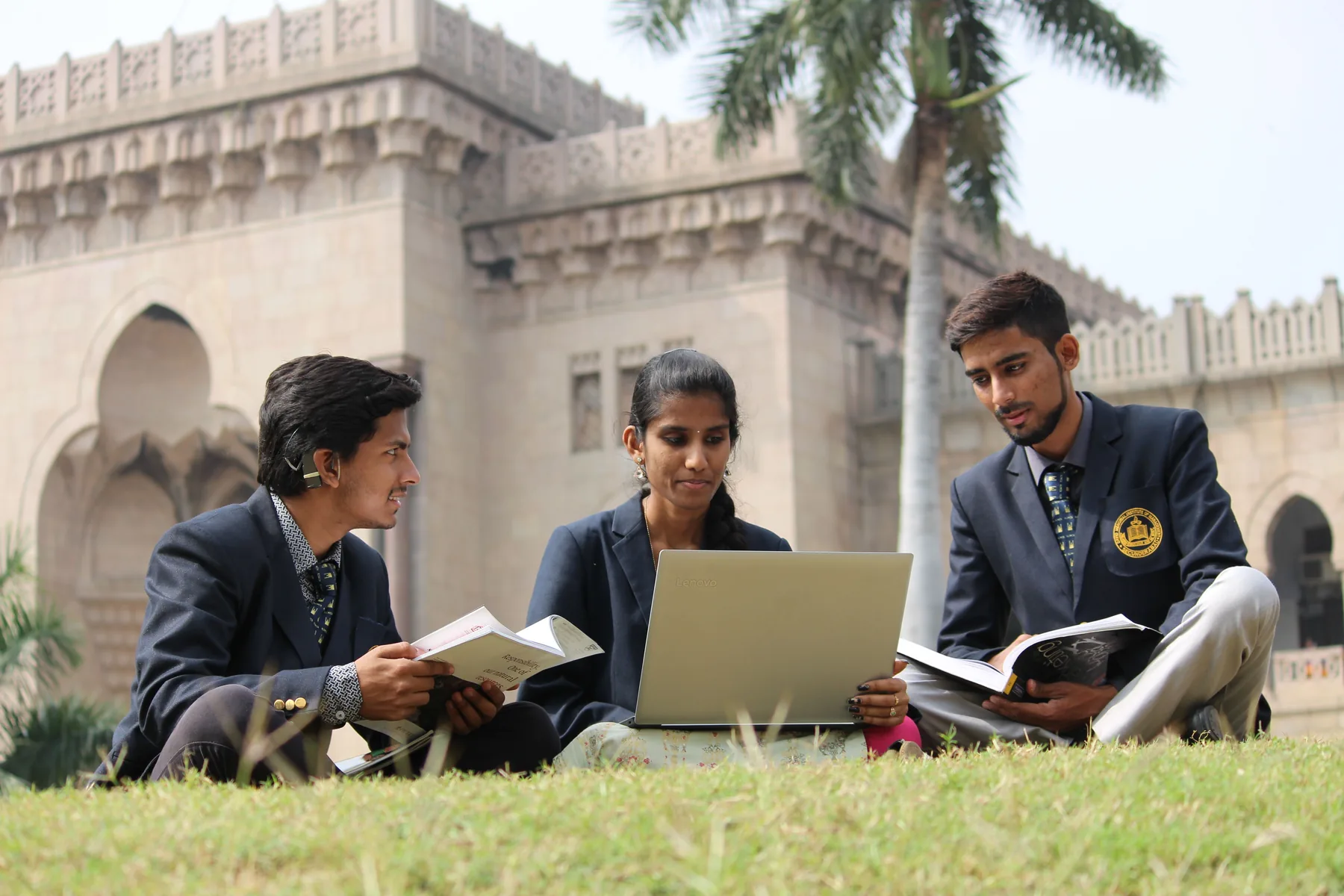 College students studying together outdoors on campus